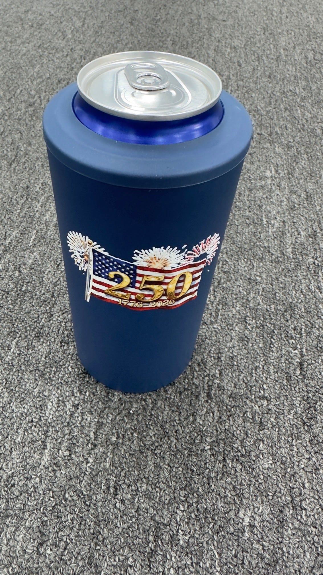 250th anniversary featuring the American Flag and fireworks 4 in 1 metal koozie.