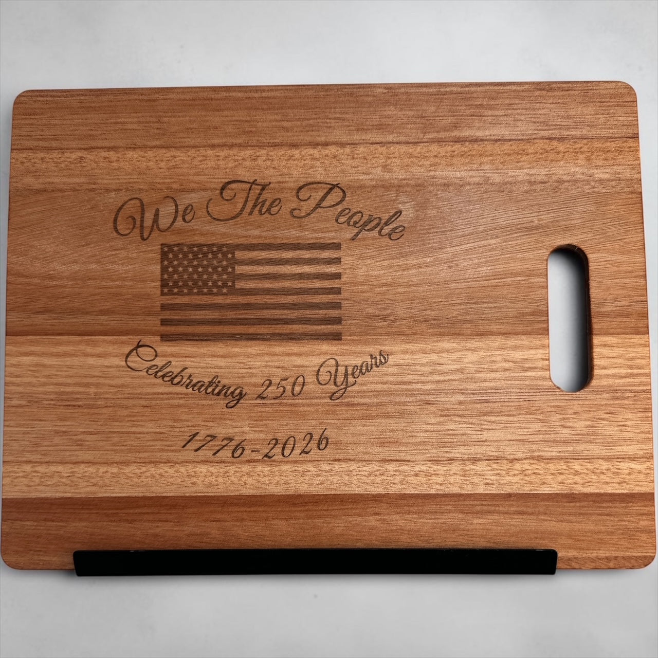 11"x14" We The People 250th Anniversary cutting board with handle.